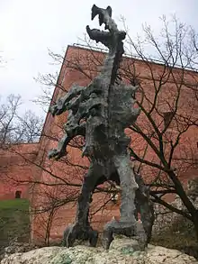 A sculpture of a dragon standing on two hind legs