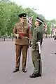 Coldstream Guards officer in No.2 dress; guardsman wears a form of No.13 dress