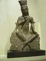 Northern Wei Maitreya Bodhisattva from the early 6th century with ankles crossed, the pose most commonly used to identify Maitreya Bodhisattva in China during this time period.