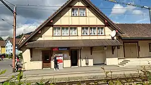 Three-story building with gabled roof