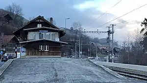 Three-story station building with gabled roof