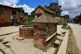 Jahru and nearby well in Sunakothi, Lalitpur District. The roof of a shelter can be seen in the background