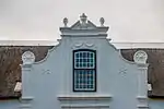 The property known as the Weltevreden farm, including all the historical buildings thereon. This H-shaped Cape Dutch dwelling-house has six elaborately finished gables. The front gable bears the date 1812. The wine-cellar was built in approximately 1804 and, together with the farm house and outbuildings, forms an important architectural complex.