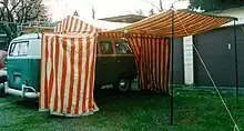VW bus with attached large tent