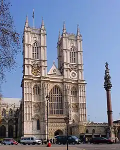 A white church with two towers.