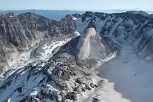 Large fairly smooth rock structure inside a crater