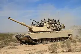82nd Airborne paratroopers ride on an M1A2 Abrams tank