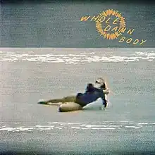 A low-quality picture of a gymnast laying on a blue mat. A hand-drawn yellow sun is in the top right corner with the title written in yellow capital letters.