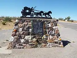 Vicinity marker where the Wickenburg Massacre took place (33°57′47″N 112°47′50″W﻿ / ﻿33.963080°N 112.797239°W﻿ / 33.963080; -112.797239)