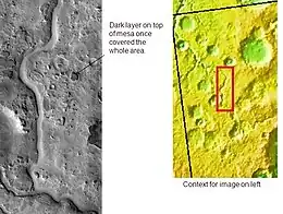 Auqakuh Vallis. At one time a dark layer covered the whole area, now only a few pieces remain as buttes. Click on image to see layers. Layers may have formed from deposition on the bottom of lakes.