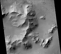 Central mound of Burton Crater, showing dark slope streaks, as seen by CTX camera (on[Mars Reconnaissance Orbiter).  Note: this is an enlargement of the previous image of Burton Crater.