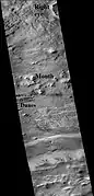 Part of Galle Crater, as seen by CTX  camera (on Mars Reconnaissance Orbiter).  The right eye and mouth are labeled.  One of two dune fields are labeled as well.