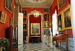 The interior of the palace featuring a gallery of paintings