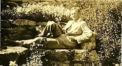 Arnold-Forster reclining in a garden in Italy around 1911