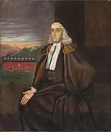 A full length seated portrait of the elderly William Stoughton. Harvard College's Stoughton Hall is visible in the background.