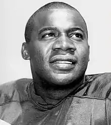 Black and white portrait of Wood wearing his Packers uniform