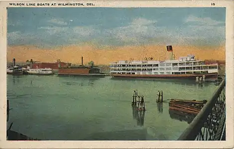 Postcard depicting Wilson Line boats on the Christina River.  The State of Pennsylvania or her identical sister ship State of Delaware on the right