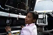 Observing the condition of the protective shutters in the Cupola during STS-131