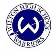 School emblem is a W pierced by a spear, surrounded by the words "Wilton High School Warriors"