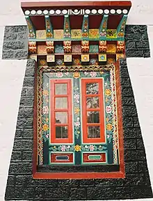 Ornately carved colourful Window of Enchey Monastery.