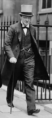 Winston Churchill in a frock coat with grey top hat.