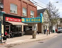 Wolfville streetscape, spring 2006. The view shows the Al Whittle (Acadia) Theatre, a house of movies and live performances now operated by a non-profit cooperative.