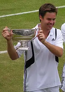 Image 28Todd Woodbridge holding the Gentlemen's doubles silver challenge cup in 2004 (from Wimbledon Championships)