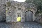 Gatehouse, gates, mounting block and wall running south for circa 20 metres