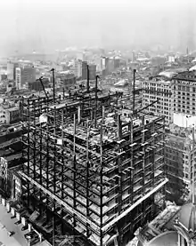 Photographs of steel girders as the Woolworth Building is built