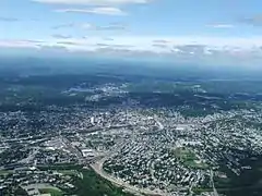 The I-290/Route 146 junction seen under construction as well as downtown Worcester from above looking north