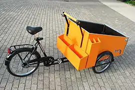 Cargo trike specially equipped for street cleaning crews; The side and rear compartments carry pick-up sticks, bag holders and other gear.