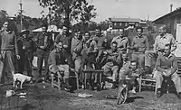 Australian Servicemen outside the Embassy Dance Hall, St Johns Wood, Ashgrove, Brisbane. Mater Dei Church in Background circa 1943