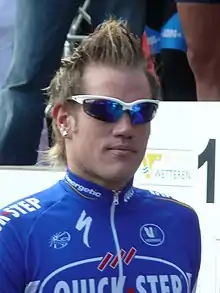A man in sunglasses and a cycling uniform