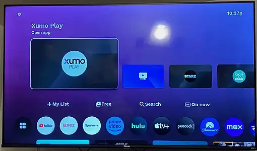 An image of a Xumo TV manufactured by Hisense, demonstrating the "Entertainment OS" user interface to be utilized by Xumo-compatible devices.