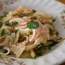 Yam hu mu is a spicy Thai salad made with slices of boiled pig's ears