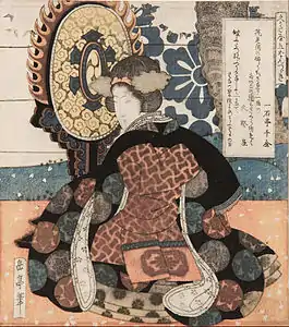 Woman Playing a Large Suspended Drum, a surimono woodblock print, circa 1827.