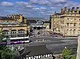 Station forecourt with hotel to the right