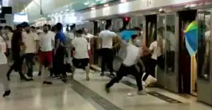 Mob dressed in white attacking passengers at Yuen Long station platform