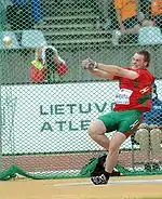 Image 9Yury Shayunou spinning with the hammer within the circle (from Track and field)