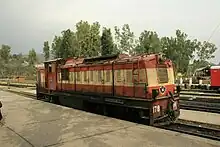 Tan-and-orange loco