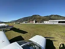 Photo of Zell am See Airport in front of two airplanes