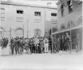 Immigrants from a smallpox ship, held in custody for observation, behind wire fence, Hoffman Island, N.Y.