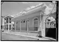 Long front porch in the Ponce Creole style at Calle Reina #118 (Casa Margarita Bestard)