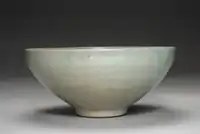 lighter glazed tea cup Goryeo celadon, incised parrot