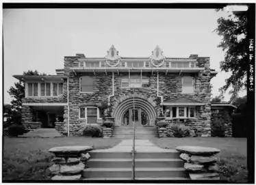 Facade, east elevation with scale rod (1988)