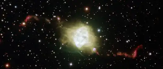 Odd pair of aging stars sculpt spectacular shape of planetary nebula.