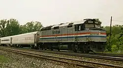 (Amtrak 345, an EMD F40PH pulls a passenger train through Porter, Indiana.