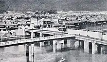 Photograph of the original Aioi Bridge from above, illustrating its T shape.