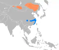 Cría (áreas del norte) en naranja y zonas de invernada (áreas del sur) en azul