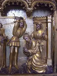 Detalle de La ejecución de Juan el Bautista en el pequeño retablo de Champmol, de Jacques de Baerze.